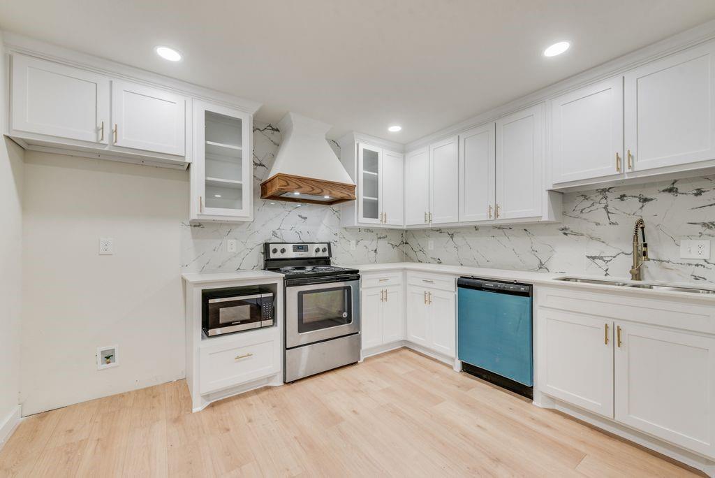 3414 Vilbig Road Dallas, TX 75212 - Photo 8 of 27 a kitchen with white cabinets and appliances