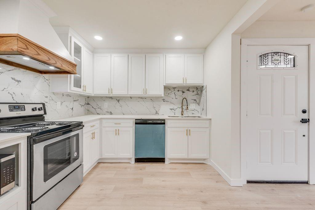 3414 Vilbig Road Dallas, TX 75212 - Photo 10 of 27 a kitchen with granite countertop white cabinets and white appliances