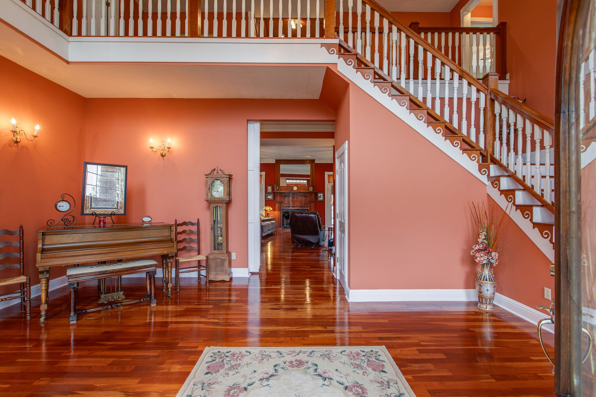 7217 Kingston Road Fairview, TN 37062 - Photo 2 of 50 a hallway with a dining table and chairs with wooden floor