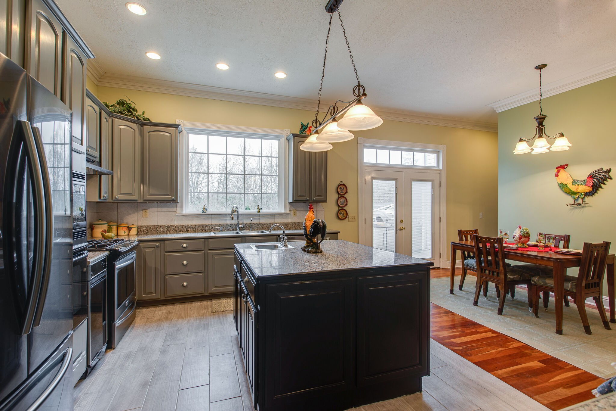 7217 Kingston Road Fairview, TN 37062 - Photo 18 of 50 a kitchen with cabinets appliances and a dining table