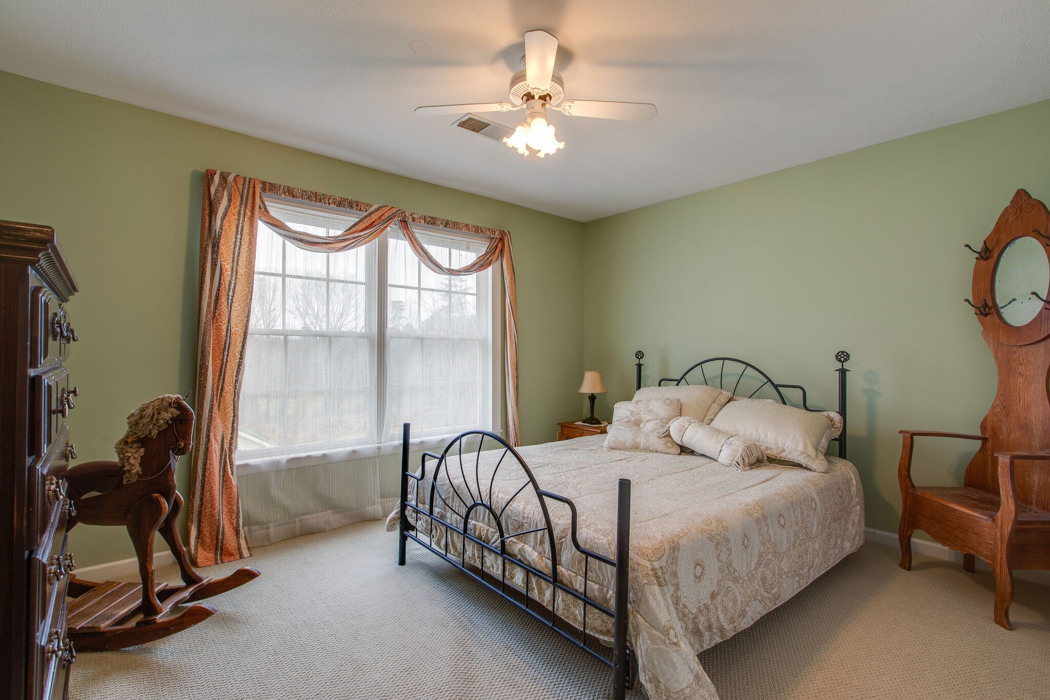 7217 Kingston Road Fairview, TN 37062 - Photo 37 of 50 a bedroom with a bed a chandelier and a window