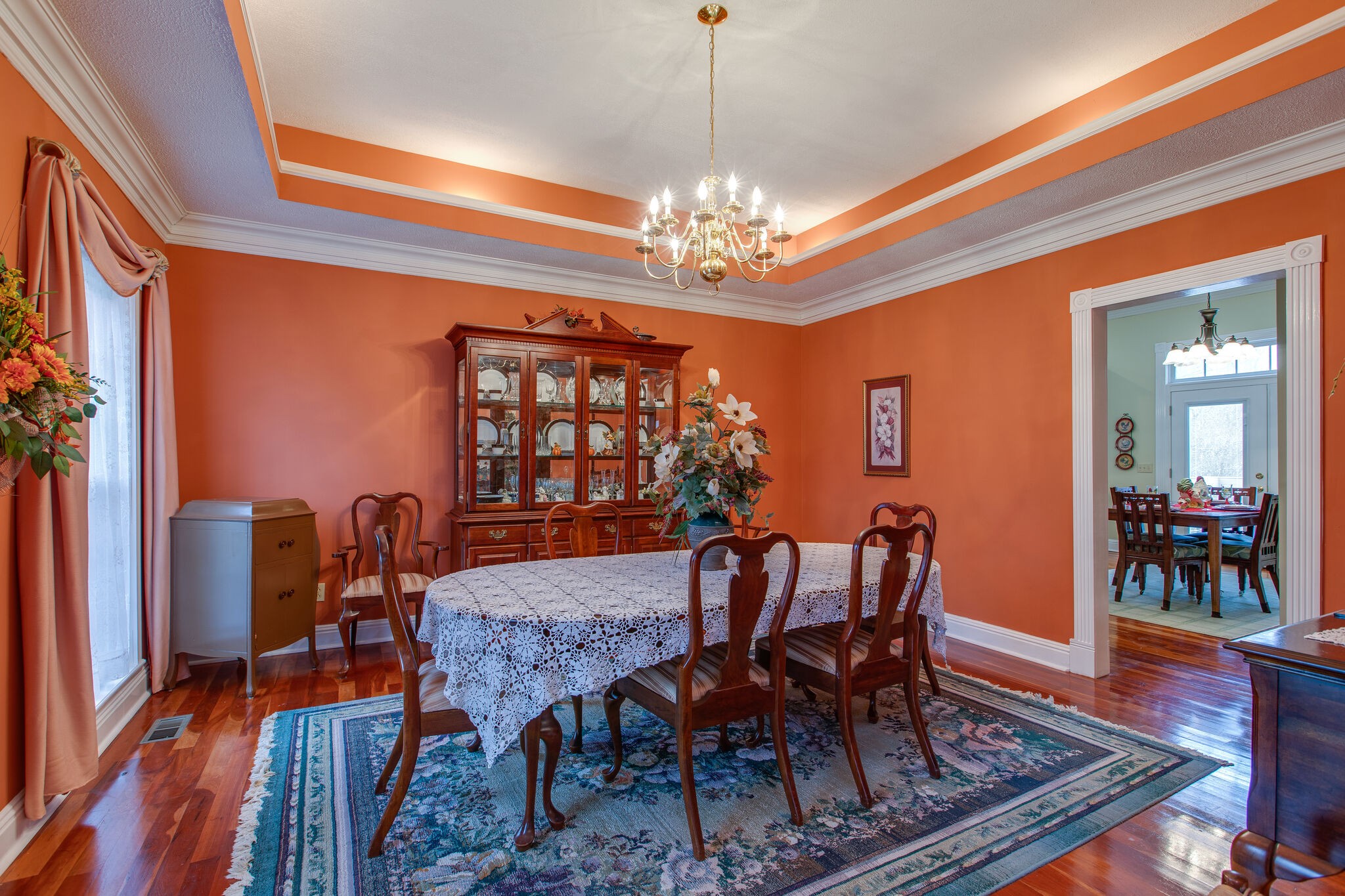 7217 Kingston Road Fairview, TN 37062 - Photo 6 of 50 a view of a dining room with furniture a chandelier and wooden floor