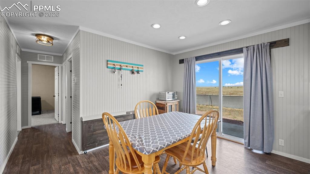 810 Awesome View Yoder, CO 80864 - Photo 11 of 43 a view of a dining room with furniture window and wooden floor