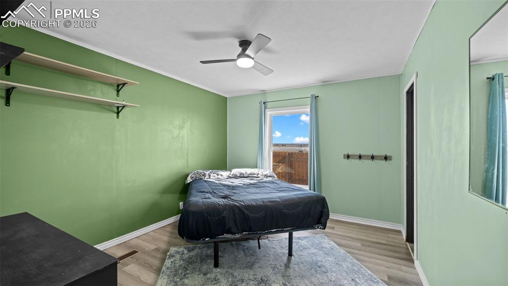 810 Awesome View Yoder, CO 80864 - Photo 22 of 43 a bedroom with a bed and a table