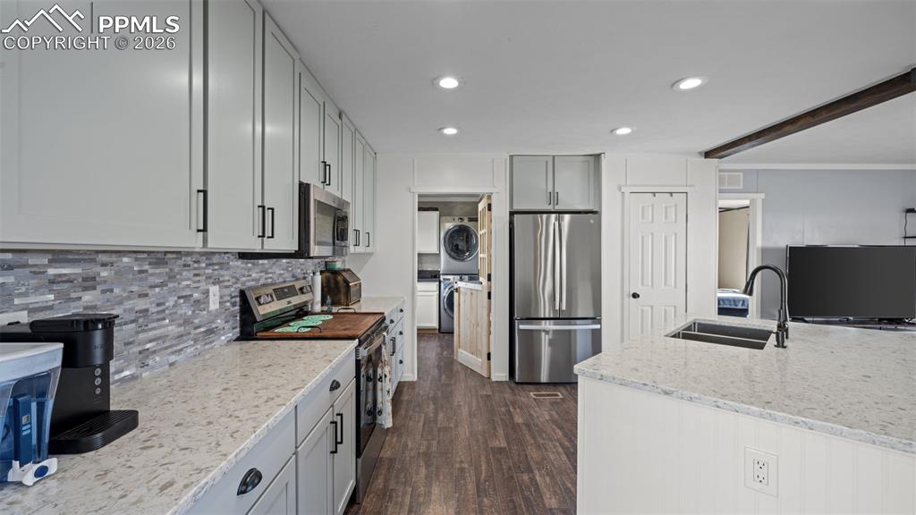 810 Awesome View Yoder, CO 80864 - Photo 8 of 43 a kitchen with stainless steel appliances granite countertop a refrigerator stove microwave and sink