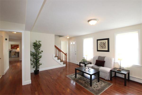 357 West Wrentham Road Cumberland, RI 02864 - Photo 8 of 18 a living room with furniture and a wooden floor