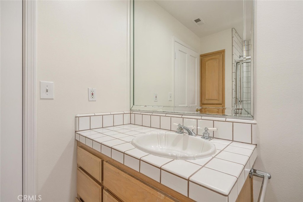 78 North Coolwater Road Bell Canyon, CA 91307 - Photo 23 of 46 a bathroom with a sink and a mirror