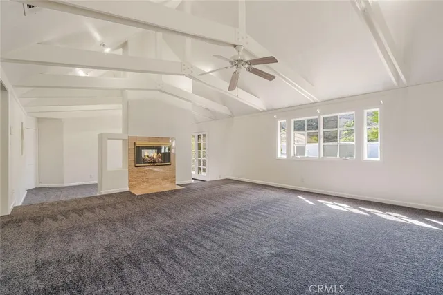 a view of empty room with windows