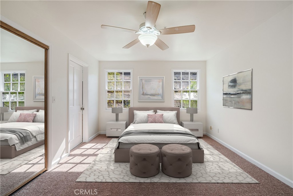 78 North Coolwater Road Bell Canyon, CA 91307 - Photo 34 of 46 a bedroom with a large bed and a chandelier