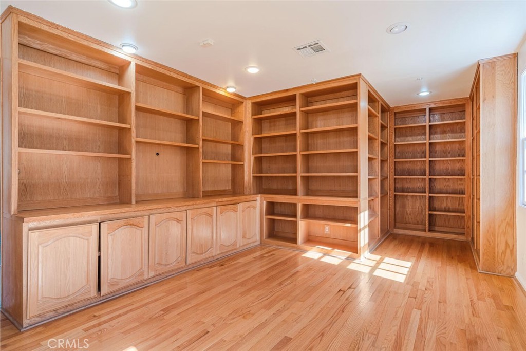 78 North Coolwater Road Bell Canyon, CA 91307 - Photo 38 of 46 a view of an empty room with a wooden floor and a window