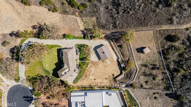 an aerial view of a highlighted house