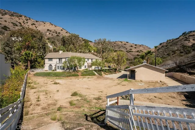 a view of a house with a mountain