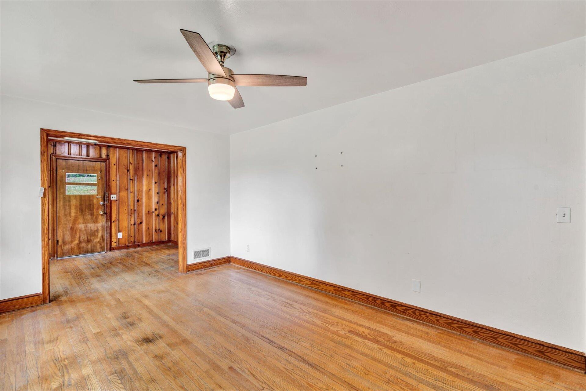 3526 Rutrough Road Southeast Roanoke, VA 24014 - Photo 12 of 33 an empty room with wooden floor cabinet and windows