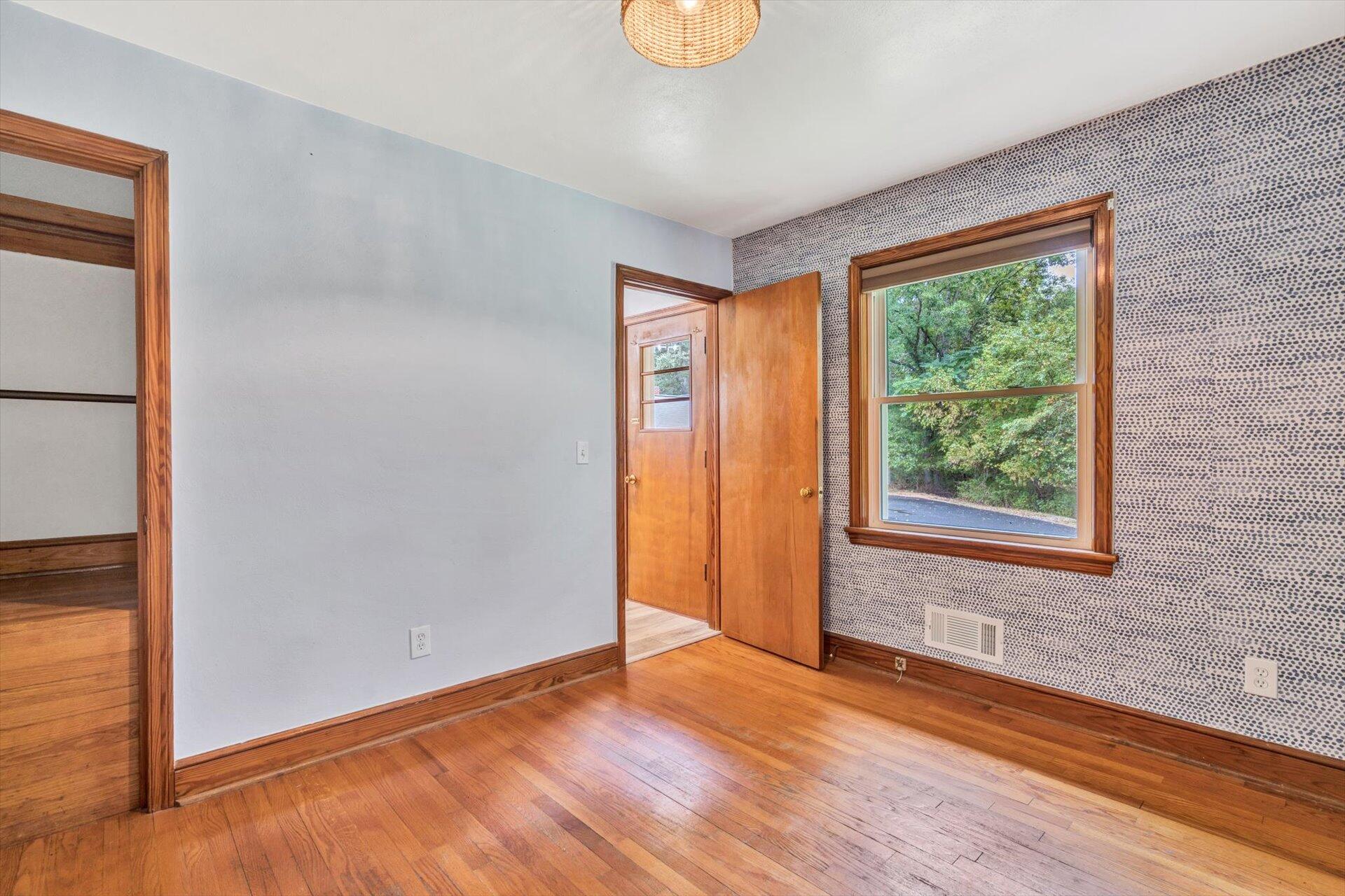 3526 Rutrough Road Southeast Roanoke, VA 24014 - Photo 17 of 33 an empty room with wooden floor and windows