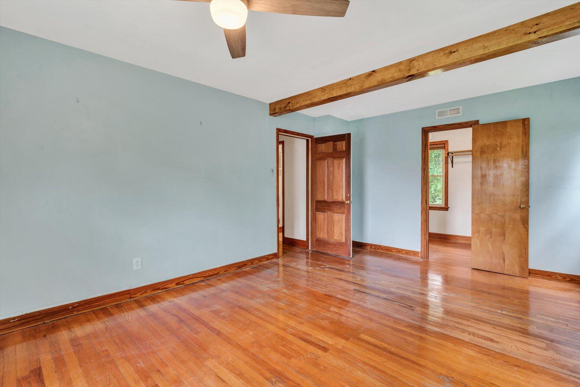 3526 Rutrough Road Southeast Roanoke, VA 24014 - Photo 22 of 33 a view of an empty room with wooden floor and a window