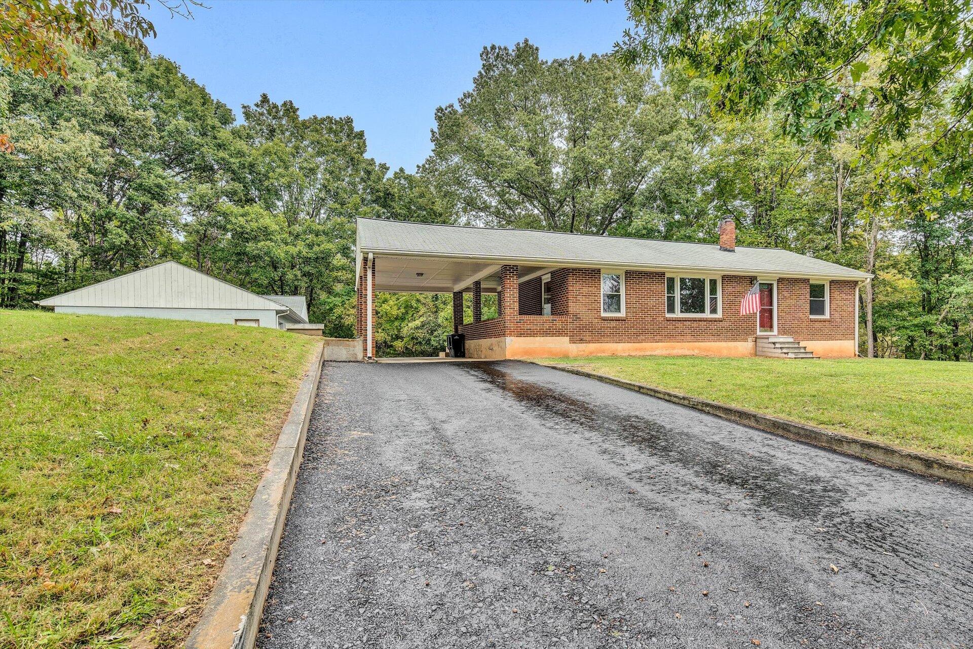 3526 Rutrough Road Southeast Roanoke, VA 24014 - Photo 6 of 33 a house view with a garden space