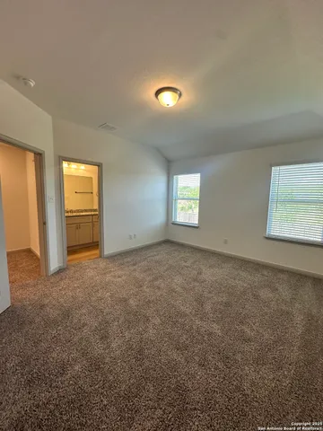 an empty room with wooden floor