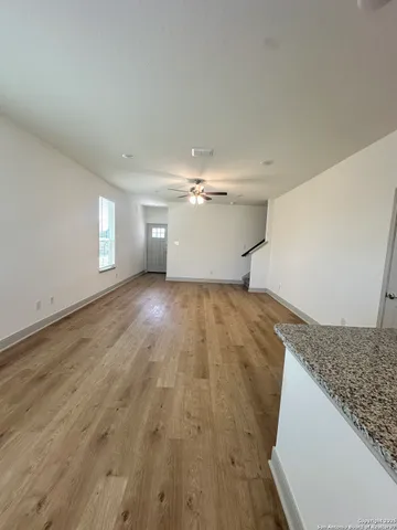 a view of a kitchen with wooden floor