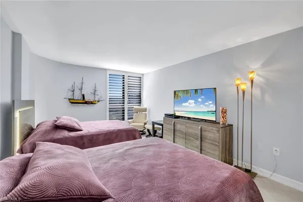 a bed room with a bed and furniture