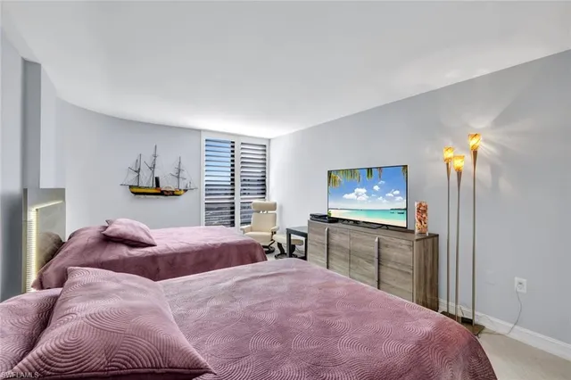 a bed room with a bed and furniture