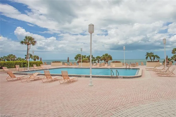 a view of a swimming pool with a patio