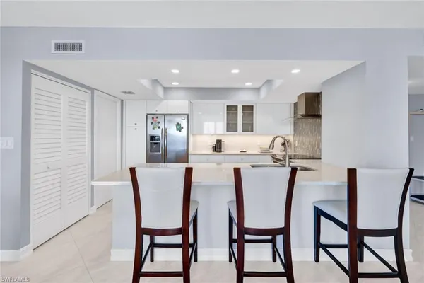 a view of a dining room with furniture and window
