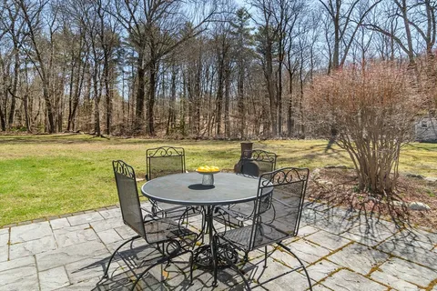 a view of a chairs and table in the patio