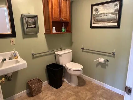 a view of a storage & utility room with a sink