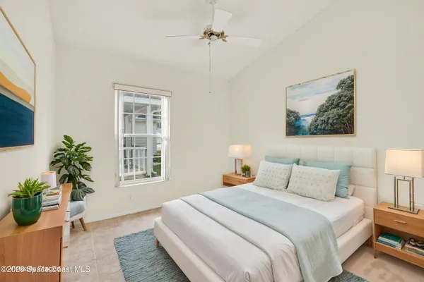 a bedroom with furniture and a window