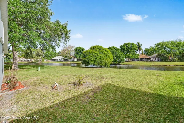 a view of a lake with a big yard
