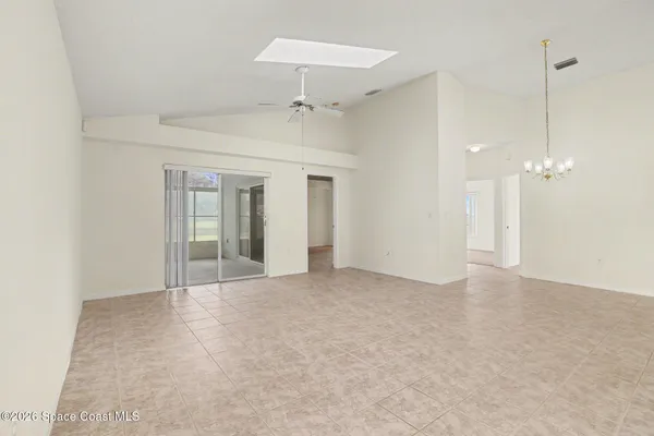 a view of an empty room with a bathroom