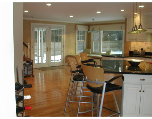 53 Fenwick Road Newton, MA 02468 - Photo 4 of 13 a view of a dining room with furniture and wooden floor