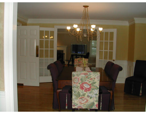 53 Fenwick Road Newton, MA 02468 - Photo 8 of 13 a view of a livingroom with furniture and a flat screen tv