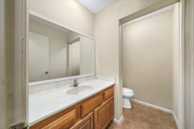 a bathroom with a double vanity sink and mirror with shower
