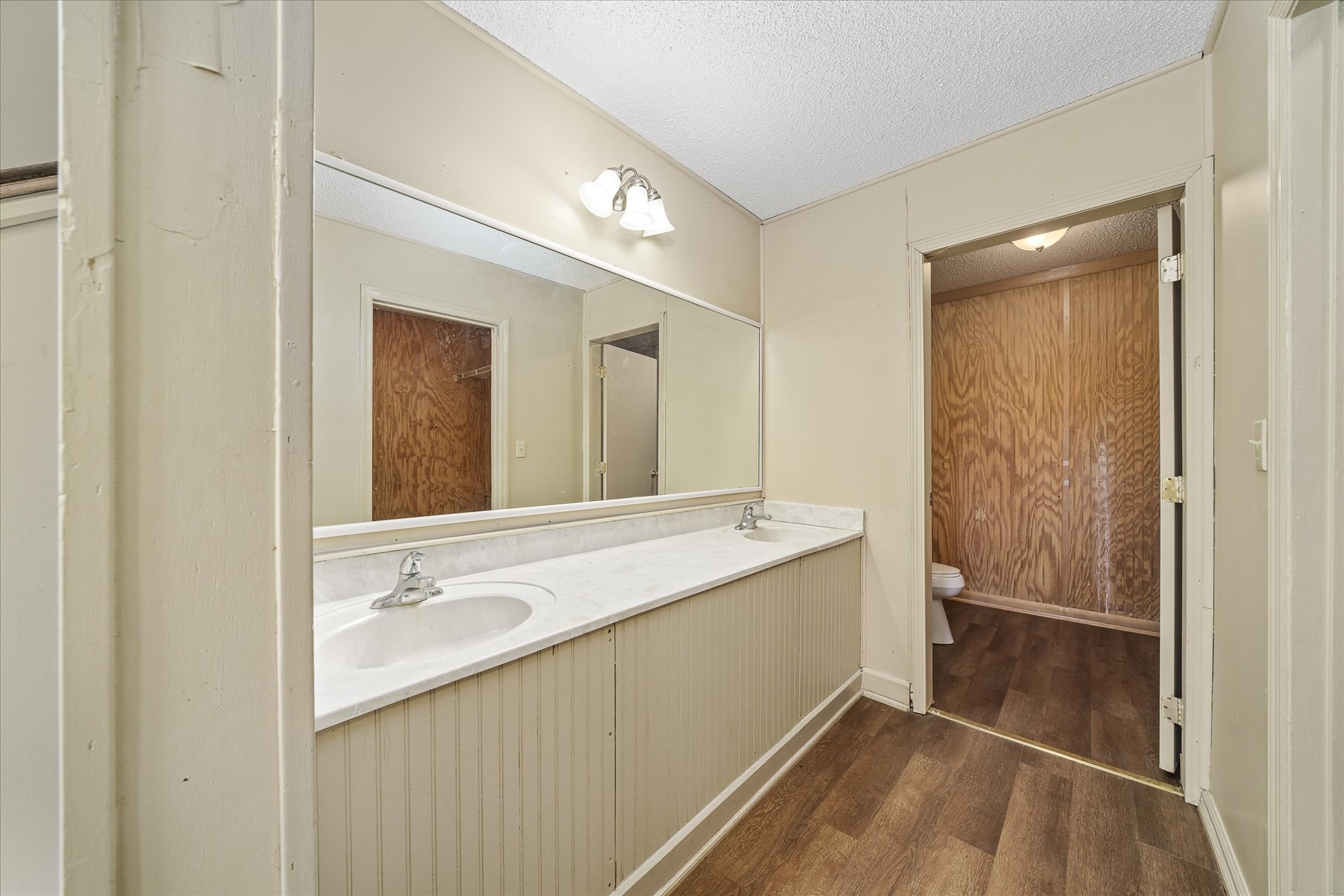 3916 Indian Mound Road Sparta, TN 38583 - Photo 21 of 48 a bathroom with a double vanity sink and mirror with shower