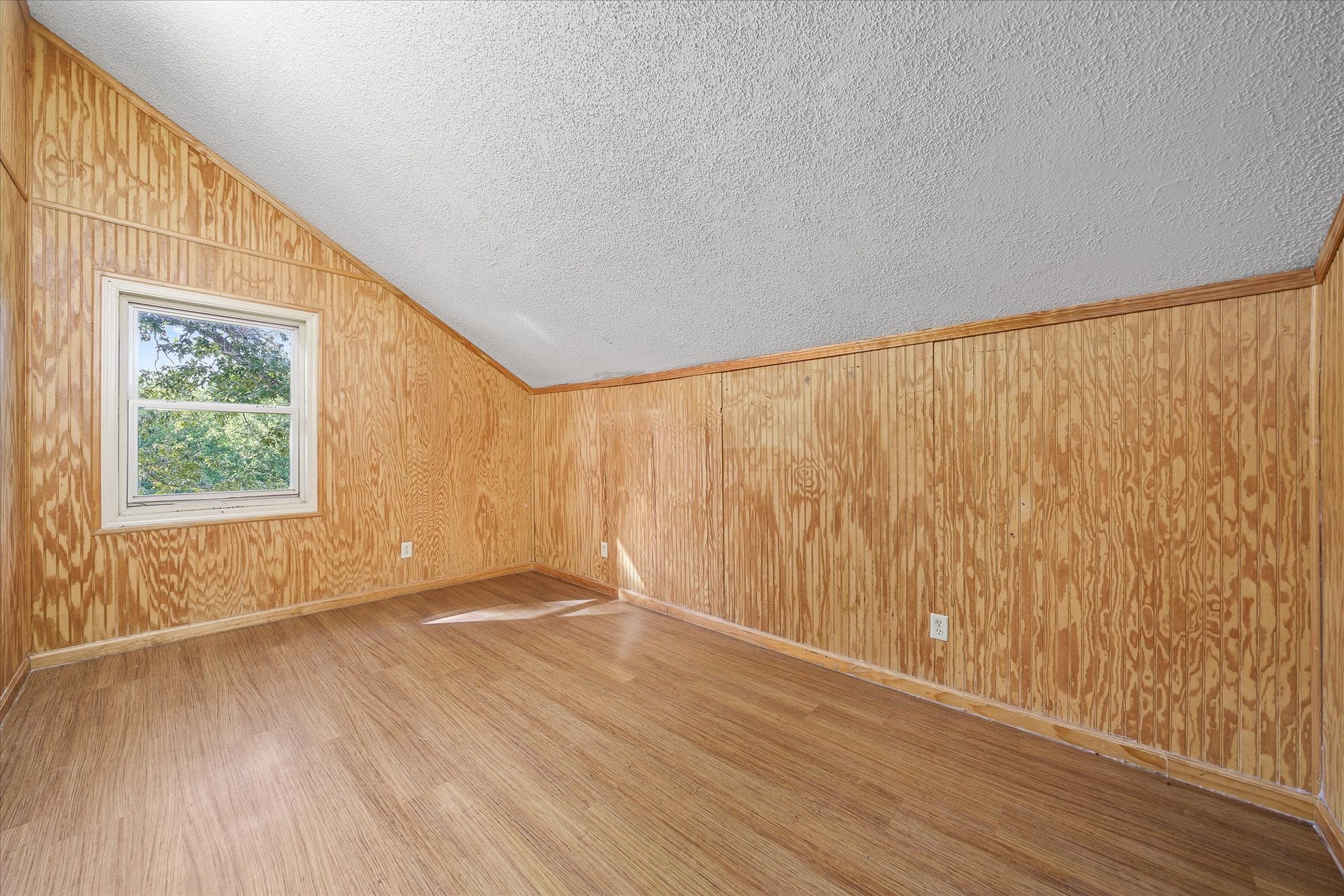 3916 Indian Mound Road Sparta, TN 38583 - Photo 28 of 48 a view of an empty room with wooden floor and a window