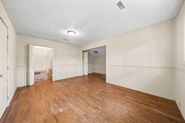 a bathroom with a shower and a sink