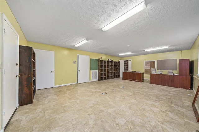 a bedroom with closet and window