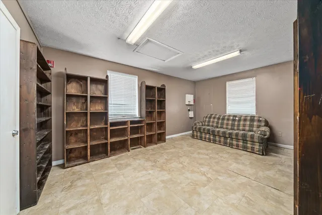 an aerial view of a green field with lots of green space