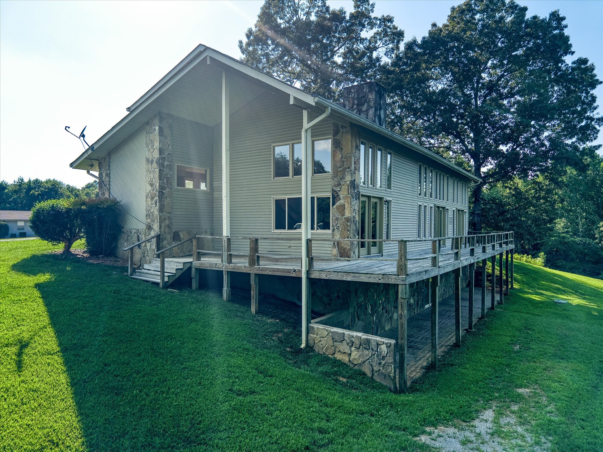 3916 Indian Mound Road Sparta, TN 38583 - Photo 4 of 48 a backyard of a house with table and chairs