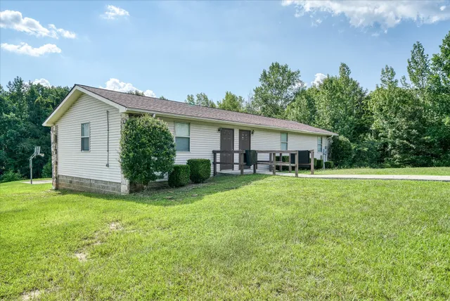 a view of a street with a yard