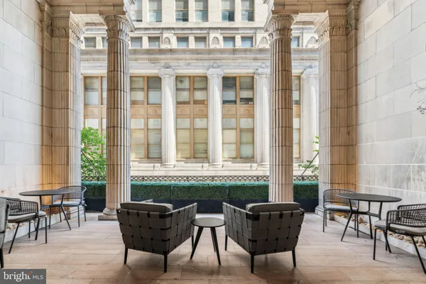 a outdoor space with patio the couches and a potted plant on a table