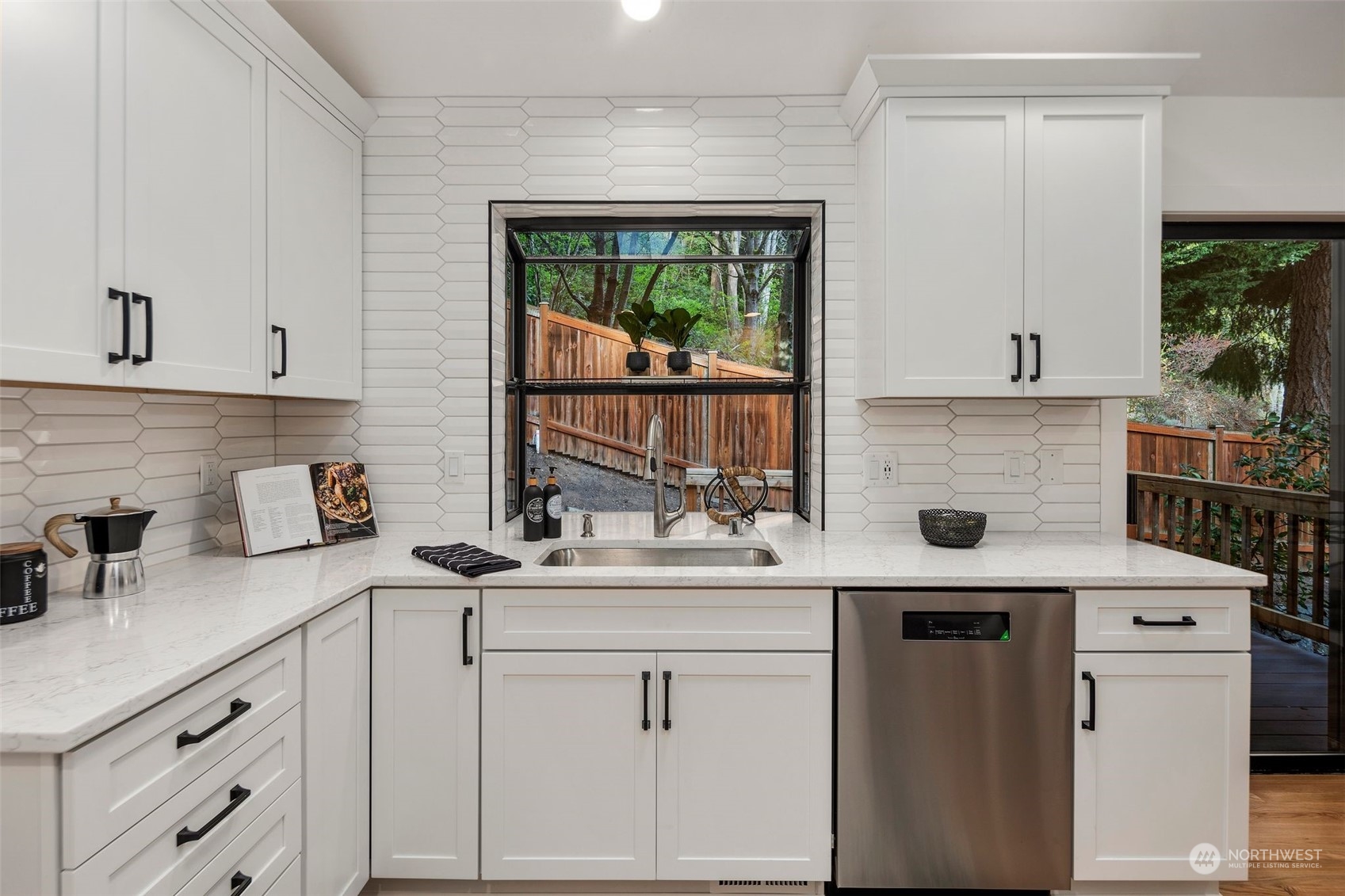 21109 Shell Valley Road Edmonds, WA 98026 - Photo 11 of 40 a kitchen with stainless steel appliances granite countertop a sink stove and cabinets