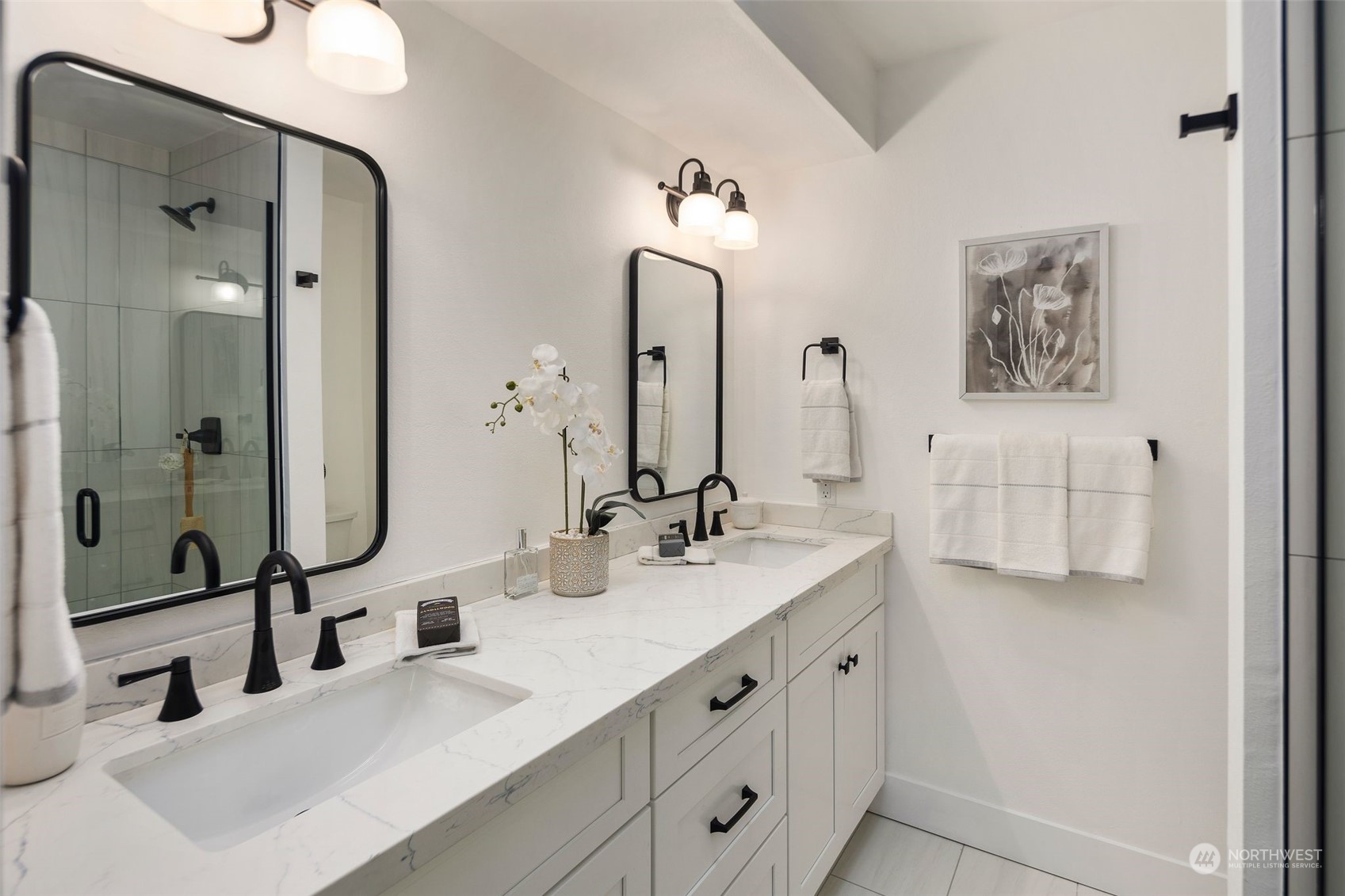 21109 Shell Valley Road Edmonds, WA 98026 - Photo 16 of 40 a bathroom with double vanity sinks double vanity tub and a mirror