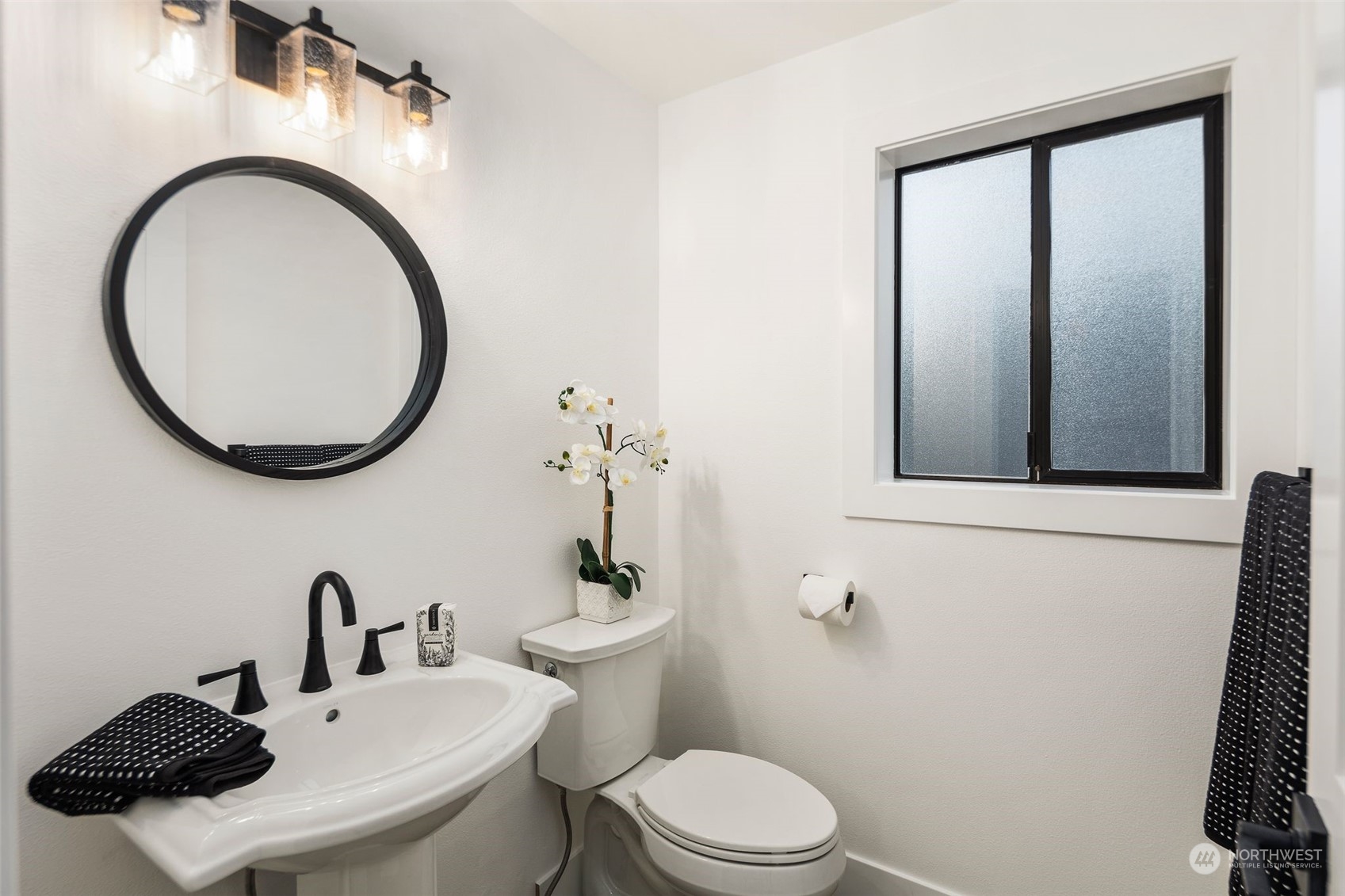 21109 Shell Valley Road Edmonds, WA 98026 - Photo 26 of 40 a bathroom with a sink a toilet and a mirror
