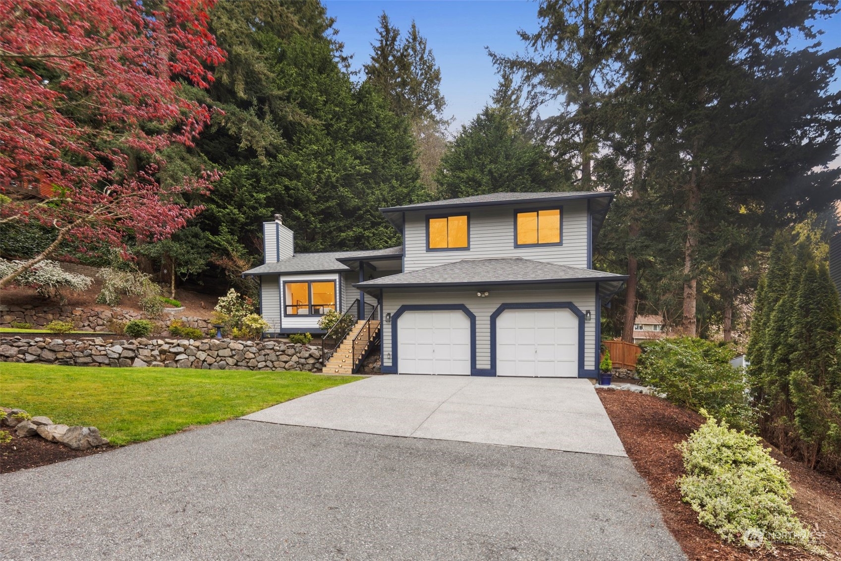 21109 Shell Valley Road Edmonds, WA 98026 - Photo 35 of 40 a front view of a house with a yard and garage