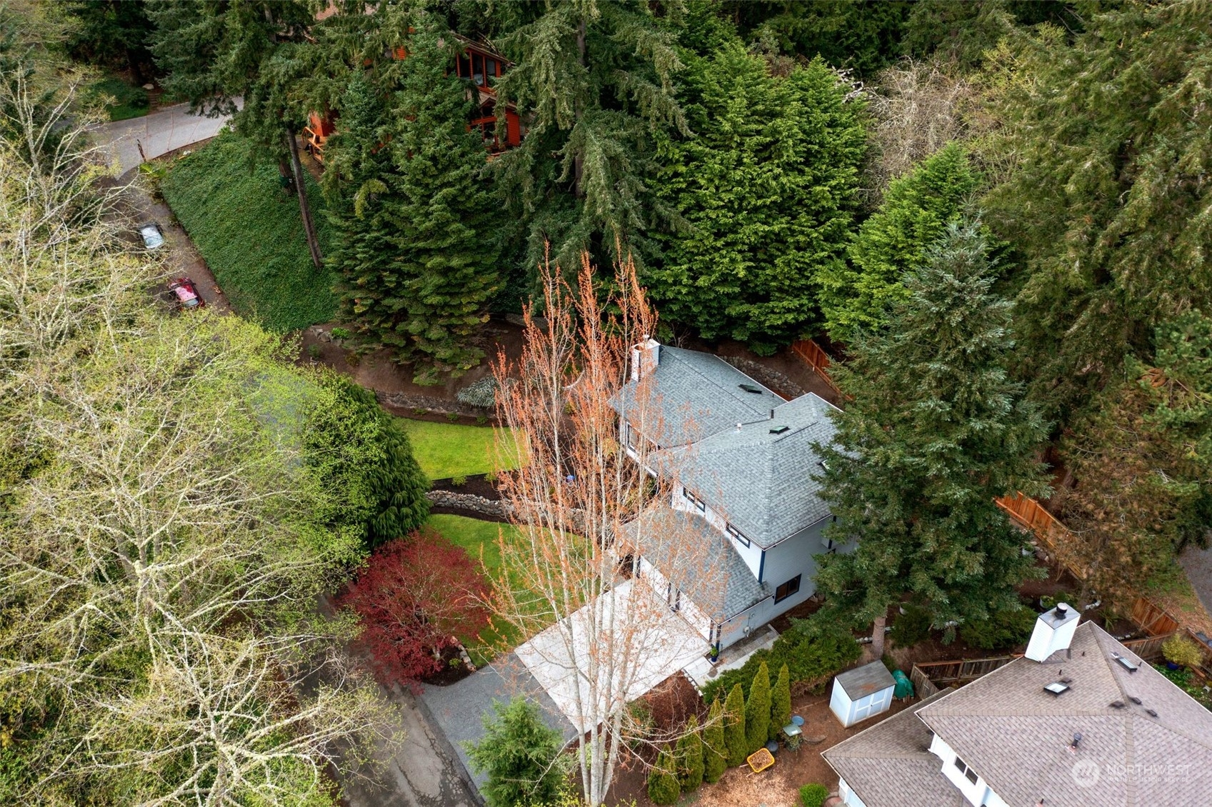 21109 Shell Valley Road Edmonds, WA 98026 - Photo 40 of 40 an aerial view of a house with a yard and large trees
