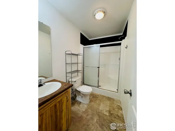 a view of a house with a sink and refrigerator