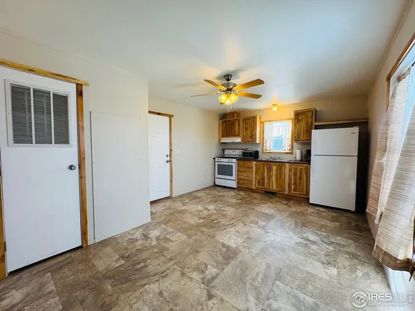 a view of a livingroom with a chandelier fan