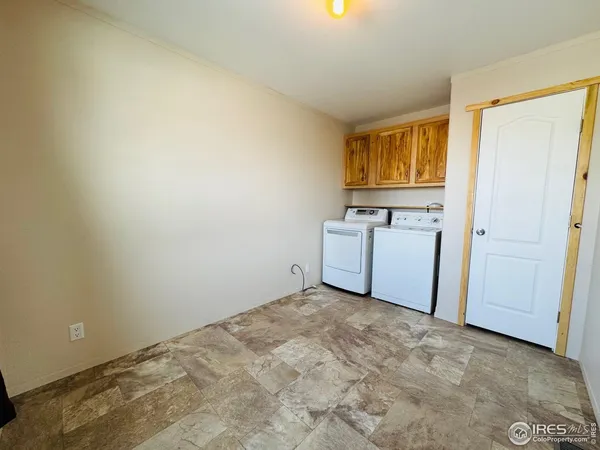 a view of a kitchen with washer and dryer